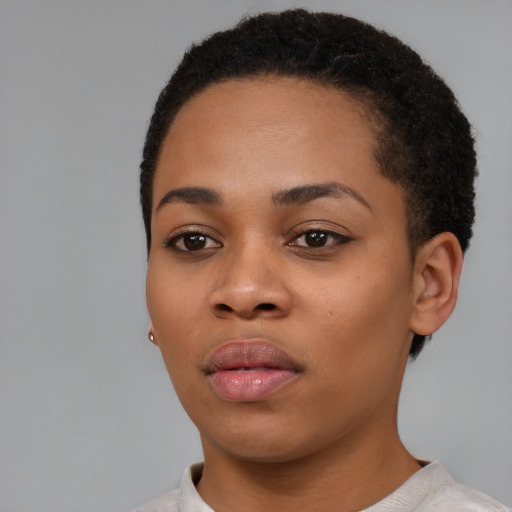 Neutral black young-adult female with short  black hair and brown eyes
