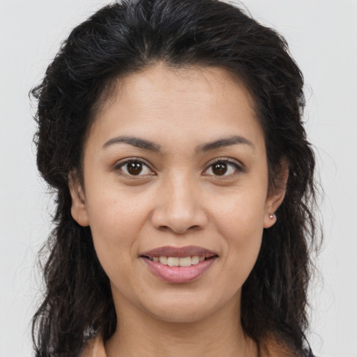 Joyful white young-adult female with long  brown hair and brown eyes