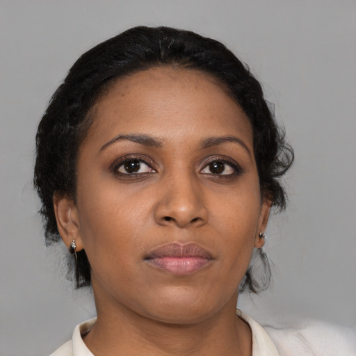 Neutral black young-adult female with short  brown hair and brown eyes