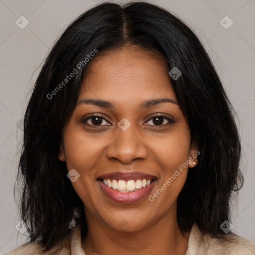 Joyful black young-adult female with long  brown hair and brown eyes