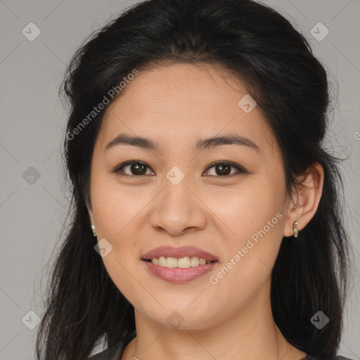 Joyful asian young-adult female with long  brown hair and brown eyes