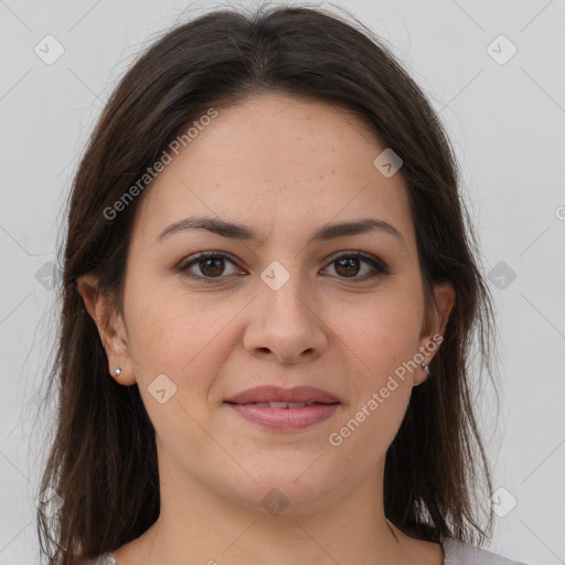 Joyful white young-adult female with long  brown hair and brown eyes