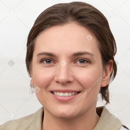 Joyful white young-adult female with medium  brown hair and grey eyes