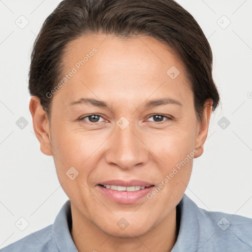 Joyful white adult female with short  brown hair and brown eyes