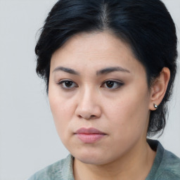 Joyful asian young-adult female with medium  black hair and brown eyes