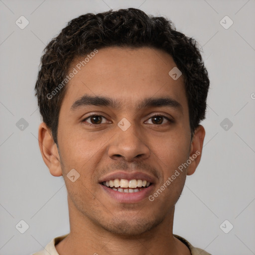 Joyful latino young-adult male with short  brown hair and brown eyes