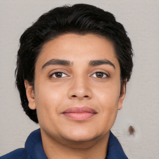Joyful white young-adult male with short  black hair and brown eyes