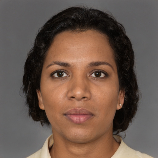 Neutral black adult female with short  brown hair and brown eyes