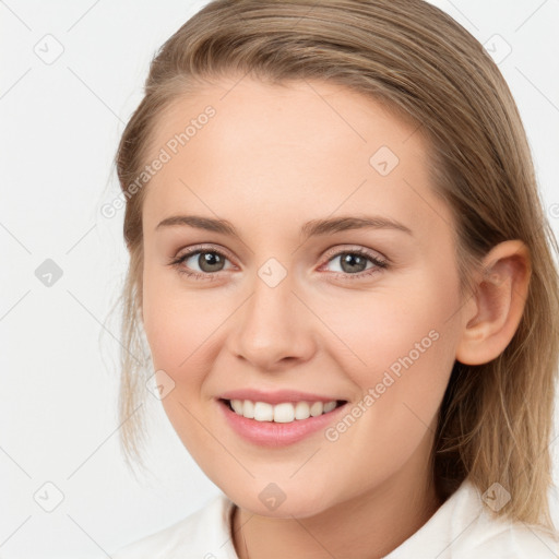 Joyful white young-adult female with medium  brown hair and blue eyes