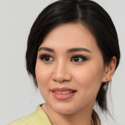 Joyful asian young-adult female with medium  black hair and brown eyes