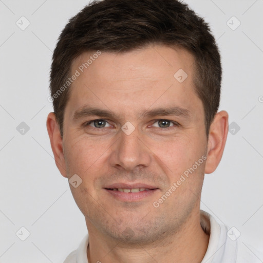 Joyful white young-adult male with short  brown hair and brown eyes