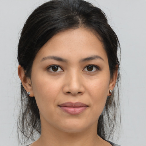 Joyful asian young-adult female with medium  brown hair and brown eyes