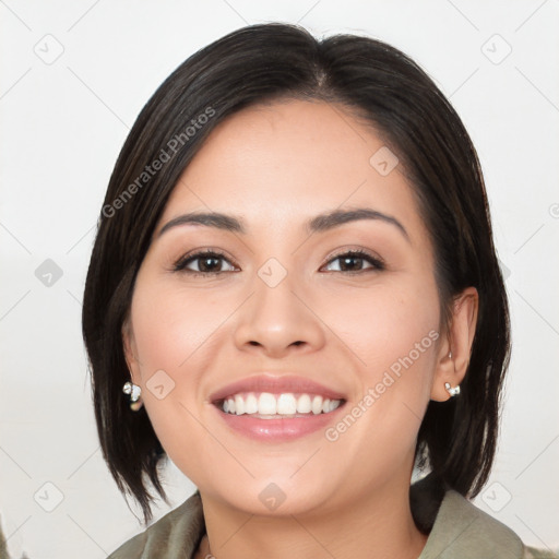 Joyful white young-adult female with medium  black hair and brown eyes