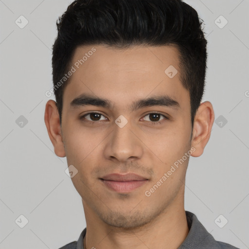 Joyful latino young-adult male with short  black hair and brown eyes