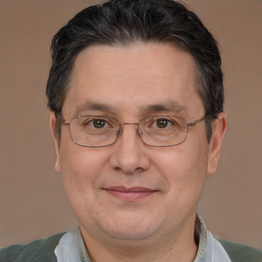 Joyful white middle-aged male with short  brown hair and brown eyes