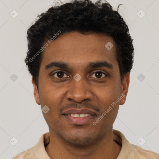 Joyful black young-adult male with short  black hair and brown eyes