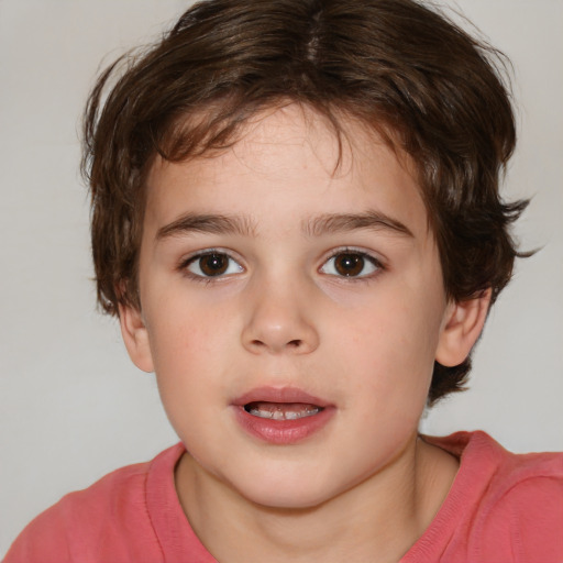 Joyful white child male with medium  brown hair and brown eyes