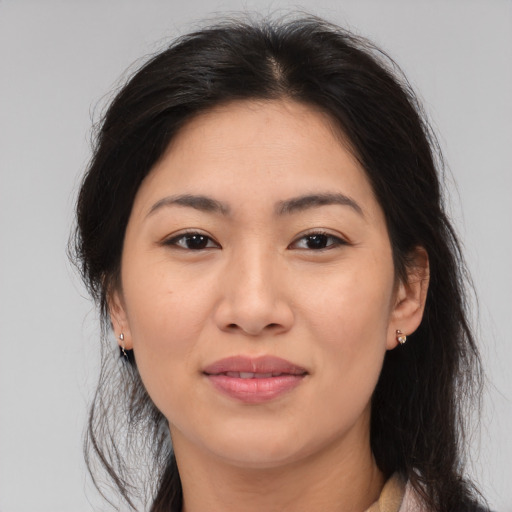 Joyful asian young-adult female with medium  brown hair and brown eyes