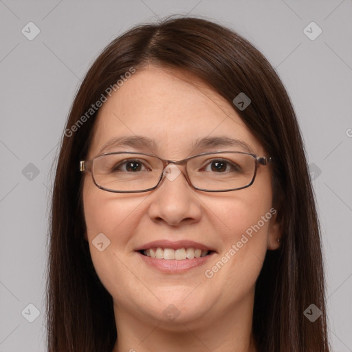 Joyful white adult female with long  brown hair and brown eyes