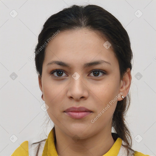 Joyful latino young-adult female with medium  brown hair and brown eyes