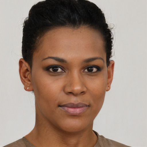 Joyful black young-adult female with short  brown hair and brown eyes