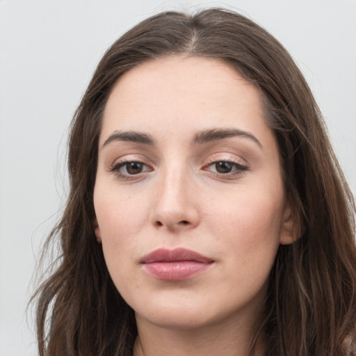 Neutral white young-adult female with long  brown hair and grey eyes