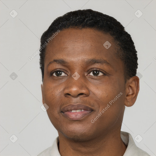 Joyful black young-adult male with short  black hair and brown eyes