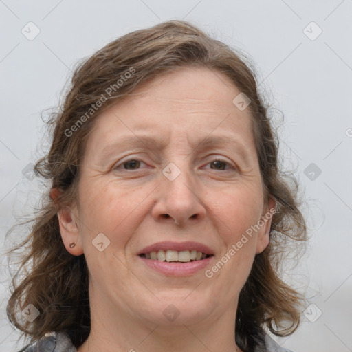 Joyful white adult female with medium  brown hair and grey eyes