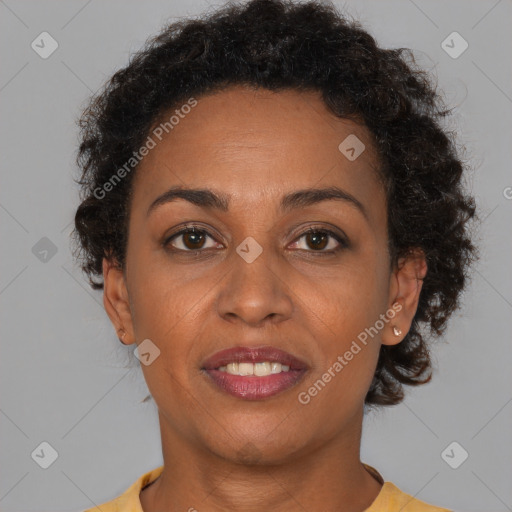 Joyful black young-adult female with short  brown hair and brown eyes