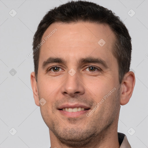 Joyful white young-adult male with short  brown hair and brown eyes