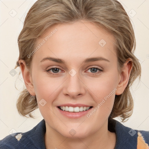 Joyful white young-adult female with medium  brown hair and blue eyes