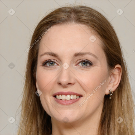 Joyful white young-adult female with long  brown hair and grey eyes