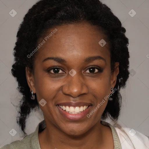 Joyful black young-adult female with medium  black hair and brown eyes