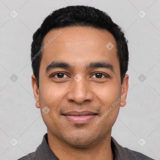 Joyful latino young-adult male with short  black hair and brown eyes