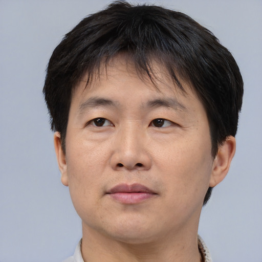 Neutral asian adult male with short  brown hair and brown eyes