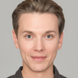 Joyful white adult male with short  brown hair and grey eyes