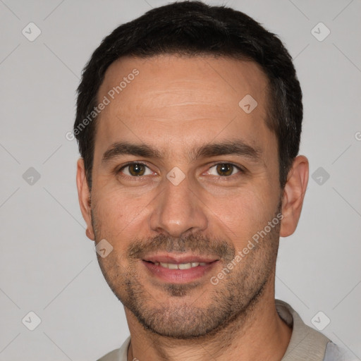 Joyful white young-adult male with short  black hair and brown eyes