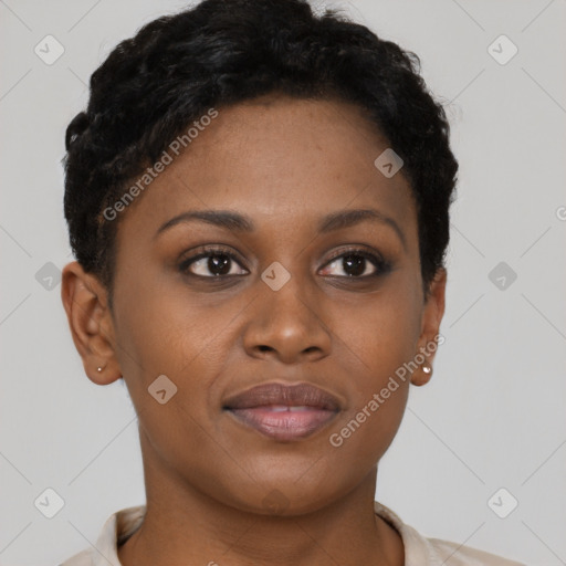 Joyful black young-adult female with short  brown hair and brown eyes