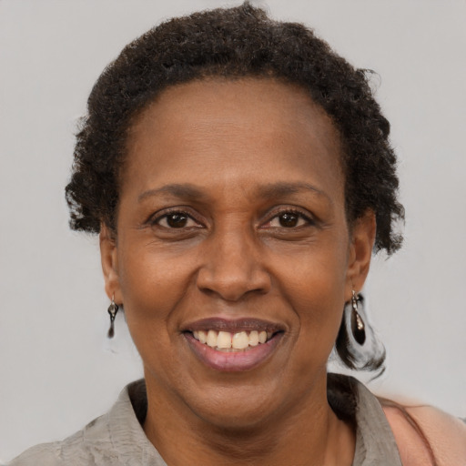 Joyful latino adult female with short  brown hair and brown eyes
