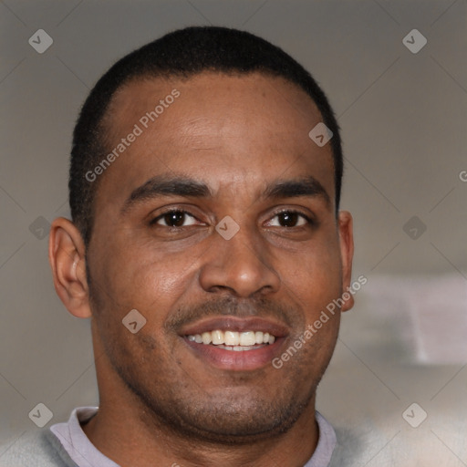 Joyful black adult male with short  brown hair and brown eyes