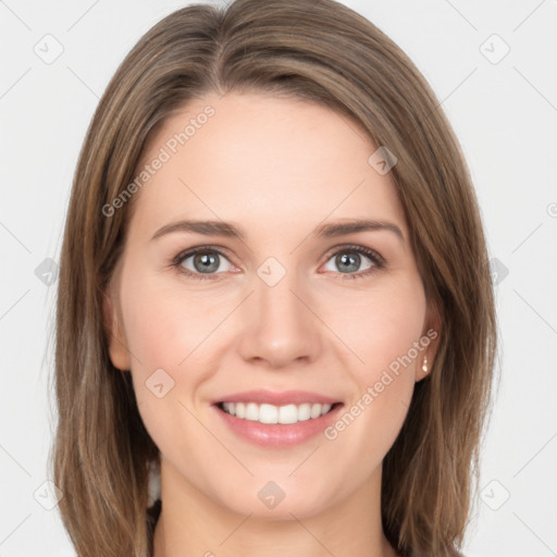 Joyful white young-adult female with long  brown hair and grey eyes