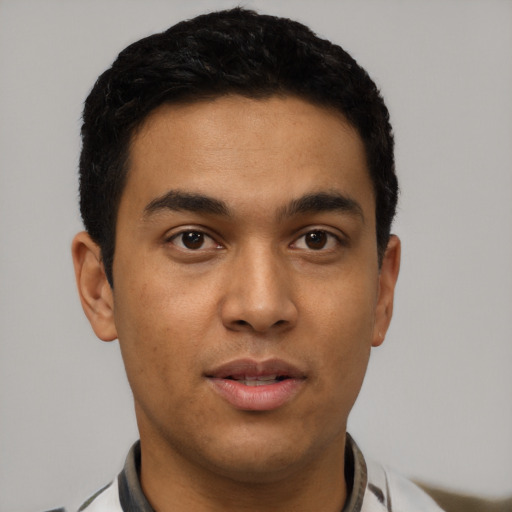 Neutral latino young-adult male with short  black hair and brown eyes