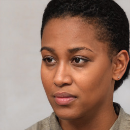 Joyful black young-adult female with short  brown hair and brown eyes