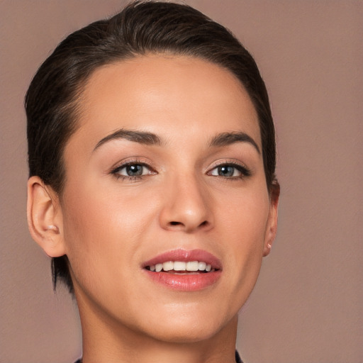 Joyful white young-adult female with medium  brown hair and brown eyes