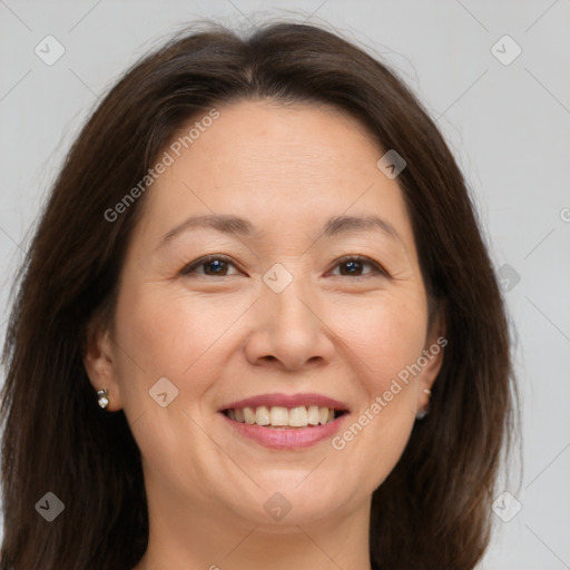 Joyful white adult female with medium  brown hair and brown eyes