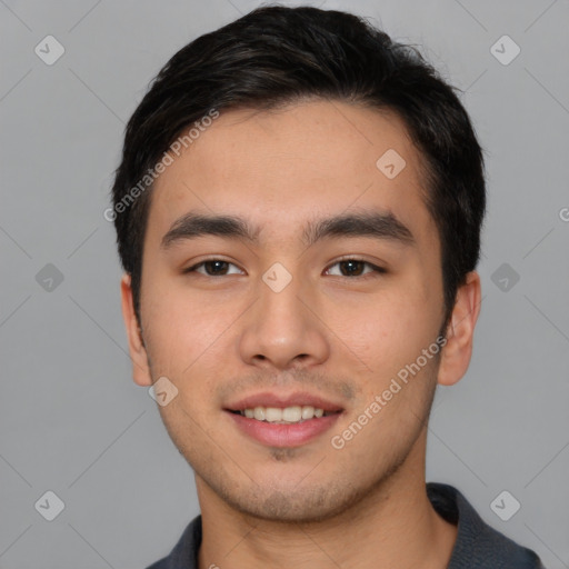 Joyful asian young-adult male with short  black hair and brown eyes