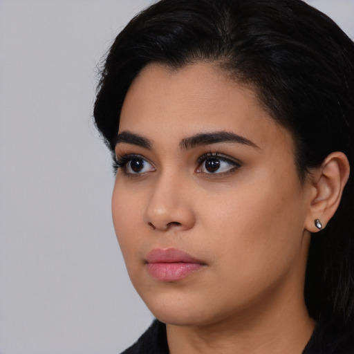 Neutral latino young-adult female with long  black hair and brown eyes