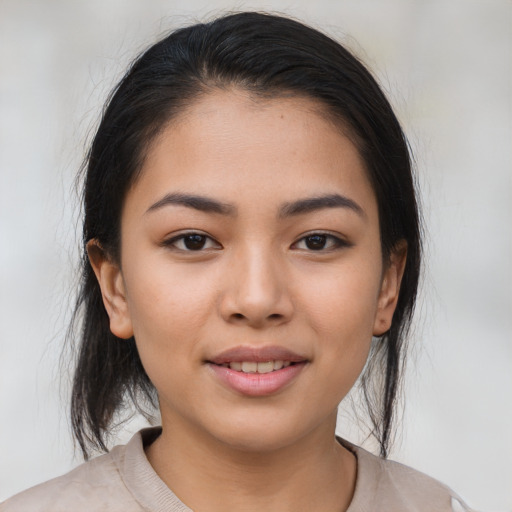 Joyful asian young-adult female with medium  brown hair and brown eyes