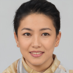 Joyful asian young-adult female with short  brown hair and brown eyes