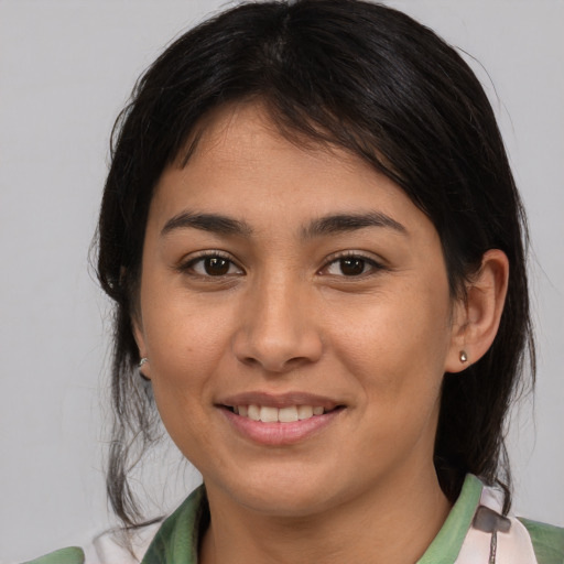 Joyful asian young-adult female with medium  brown hair and brown eyes